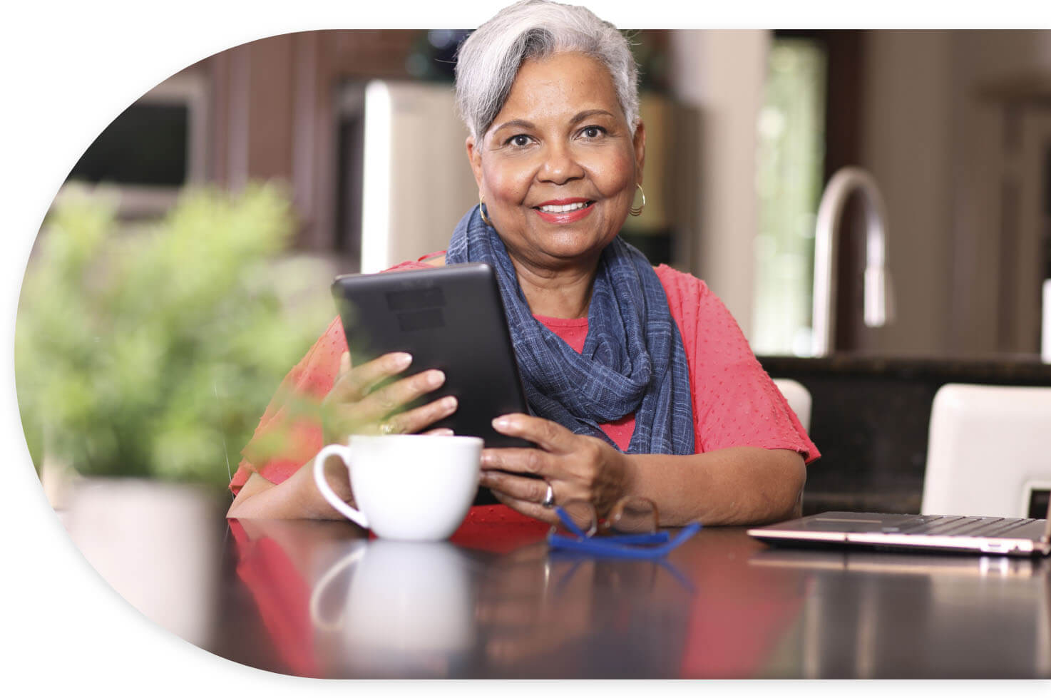 Naomi, a hypothetical patient with type 2 diabetes, researches NEXLIZET on her tablet while drinking coffee